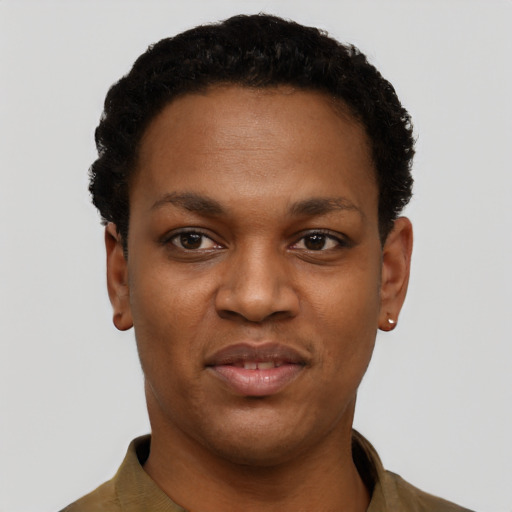 Joyful black young-adult female with short  black hair and brown eyes