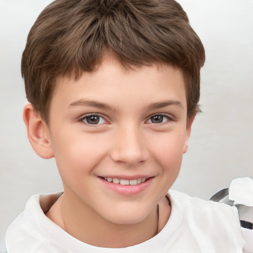 Joyful white child male with short  brown hair and brown eyes