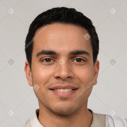 Joyful latino young-adult male with short  black hair and brown eyes