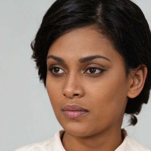 Neutral asian young-adult female with medium  black hair and brown eyes