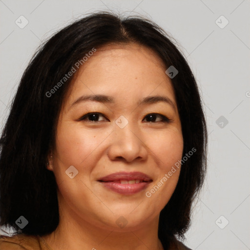 Joyful asian young-adult female with long  brown hair and brown eyes