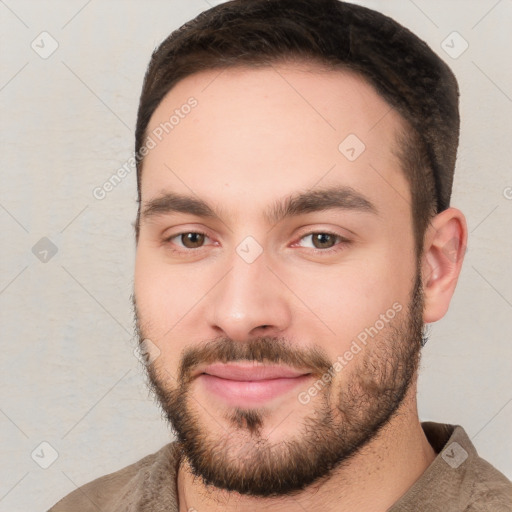 Joyful white young-adult male with short  brown hair and brown eyes