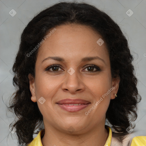 Joyful black adult female with medium  brown hair and brown eyes