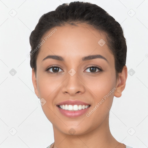 Joyful latino young-adult female with short  brown hair and brown eyes