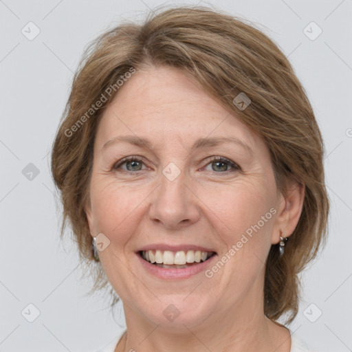 Joyful white adult female with medium  brown hair and grey eyes