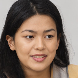 Joyful asian young-adult female with long  brown hair and brown eyes