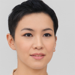 Joyful asian young-adult female with short  brown hair and brown eyes