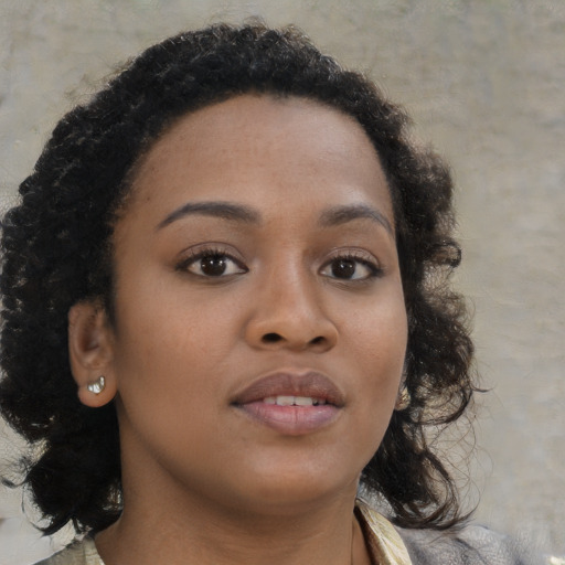 Neutral black young-adult female with medium  brown hair and brown eyes