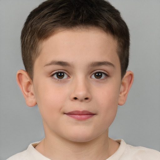 Joyful white child male with short  brown hair and brown eyes