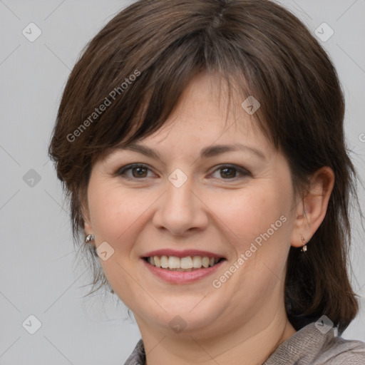 Joyful white adult female with medium  brown hair and brown eyes