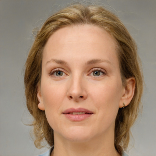 Joyful white young-adult female with medium  brown hair and blue eyes