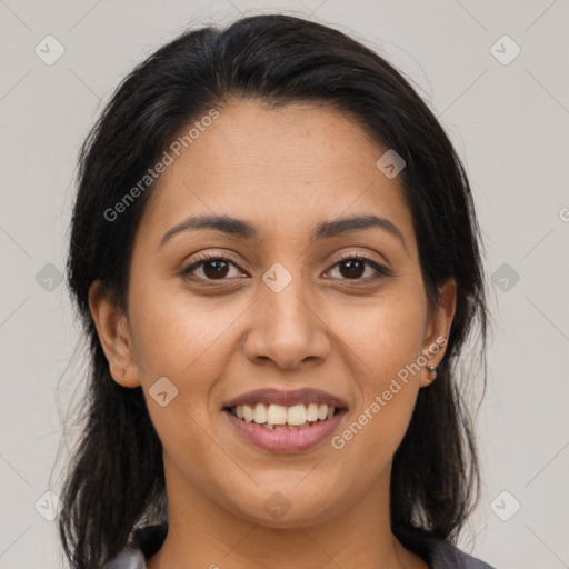 Joyful latino young-adult female with medium  brown hair and brown eyes