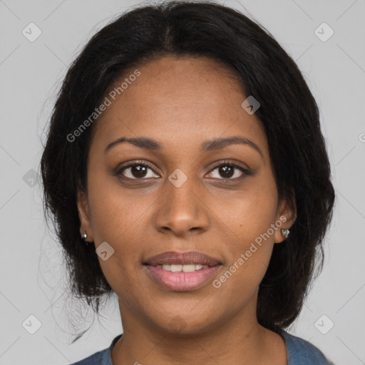 Joyful black young-adult female with medium  brown hair and brown eyes