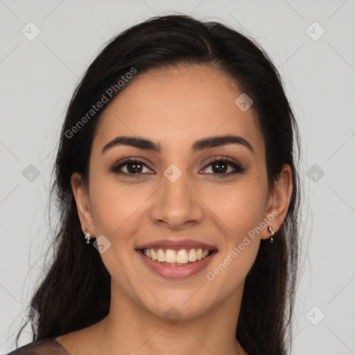 Joyful latino young-adult female with long  brown hair and brown eyes