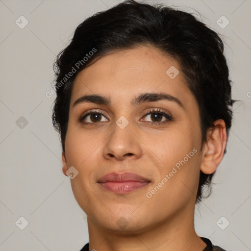 Joyful latino young-adult female with medium  brown hair and brown eyes