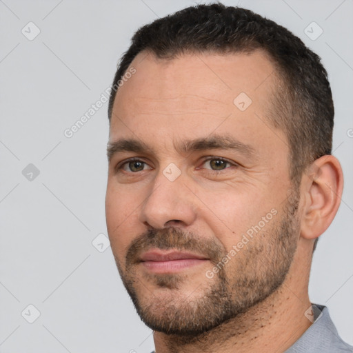 Joyful white adult male with short  brown hair and brown eyes