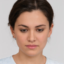 Neutral white young-adult female with medium  brown hair and brown eyes