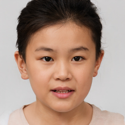 Joyful white child female with short  brown hair and brown eyes
