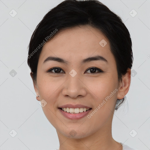 Joyful asian young-adult female with short  black hair and brown eyes