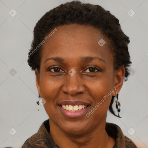 Joyful black adult female with short  brown hair and brown eyes