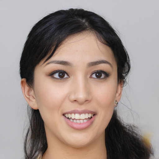 Joyful asian young-adult female with long  black hair and brown eyes