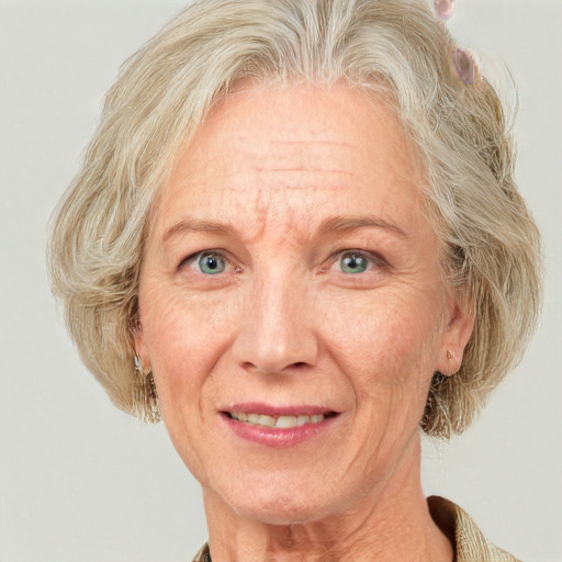 Joyful white middle-aged female with medium  blond hair and blue eyes