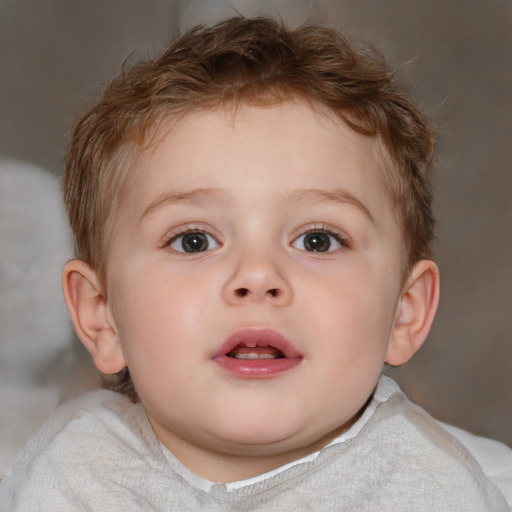 Joyful white child male with short  brown hair and blue eyes