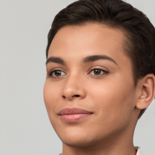 Joyful white young-adult female with short  brown hair and brown eyes