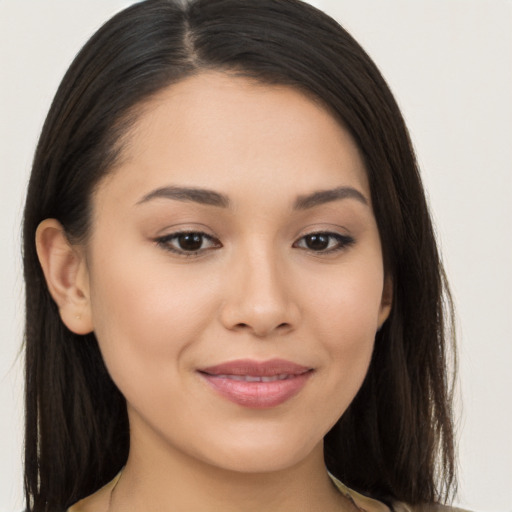 Joyful latino young-adult female with long  brown hair and brown eyes