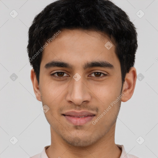 Joyful latino young-adult male with short  black hair and brown eyes