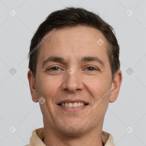 Joyful white adult male with short  brown hair and brown eyes