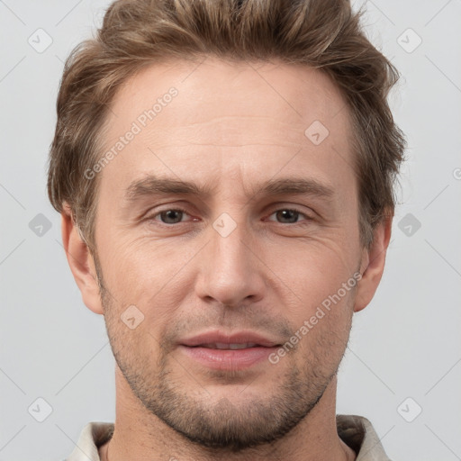 Joyful white adult male with short  brown hair and grey eyes