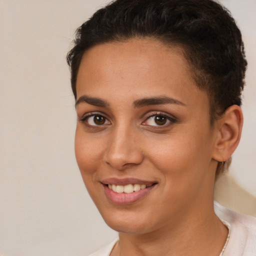 Joyful white young-adult female with short  brown hair and brown eyes
