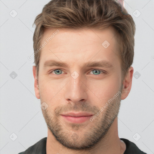 Joyful white young-adult male with short  brown hair and grey eyes