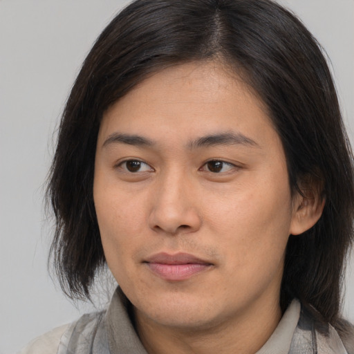 Joyful asian young-adult female with medium  brown hair and brown eyes