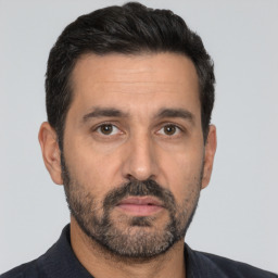 Neutral white adult male with short  black hair and brown eyes