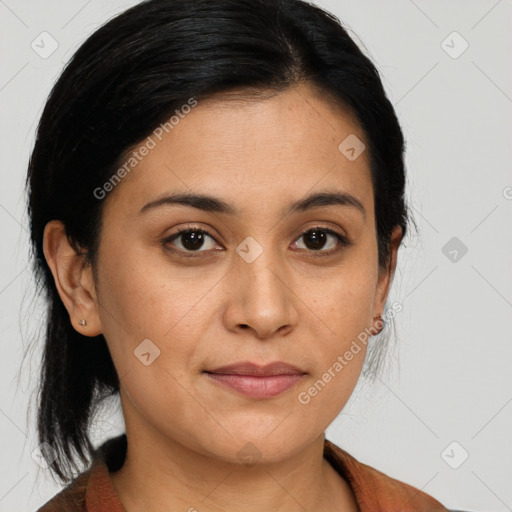 Joyful latino young-adult female with medium  brown hair and brown eyes