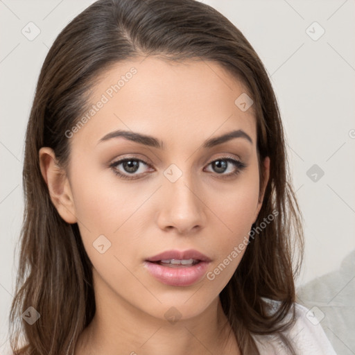 Neutral white young-adult female with long  brown hair and brown eyes