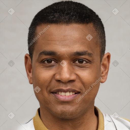 Joyful latino young-adult male with short  black hair and brown eyes