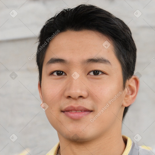 Joyful asian young-adult male with short  black hair and brown eyes