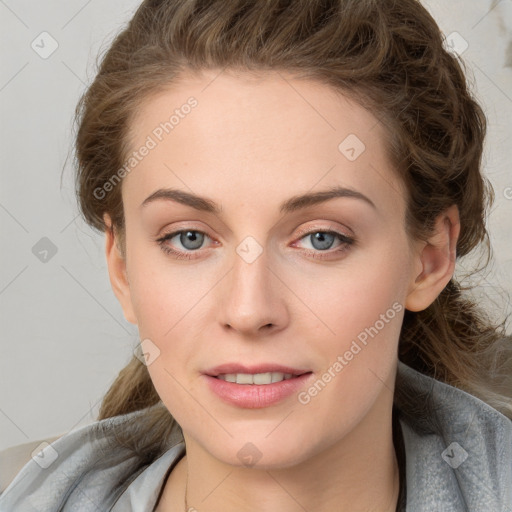 Joyful white young-adult female with medium  brown hair and blue eyes