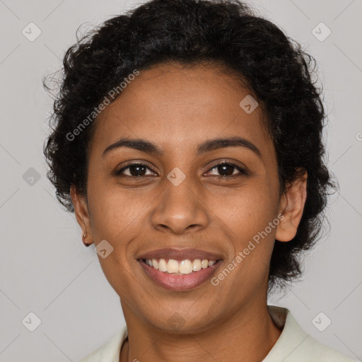 Joyful black young-adult female with short  brown hair and brown eyes