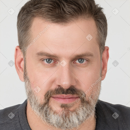 Joyful white adult male with short  brown hair and grey eyes