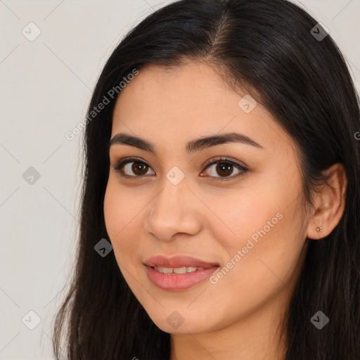 Joyful latino young-adult female with long  brown hair and brown eyes