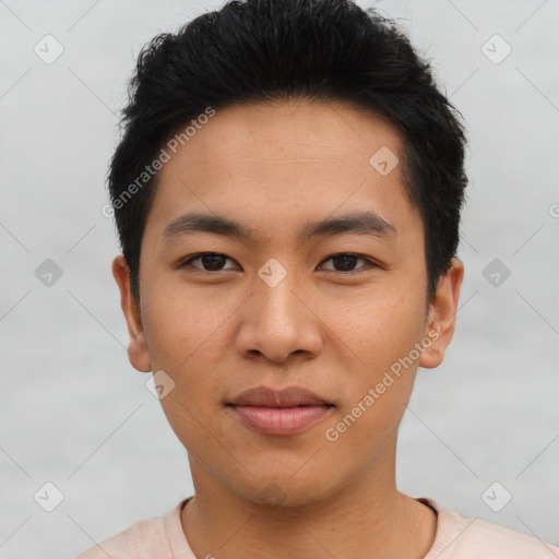 Joyful asian young-adult male with short  black hair and brown eyes