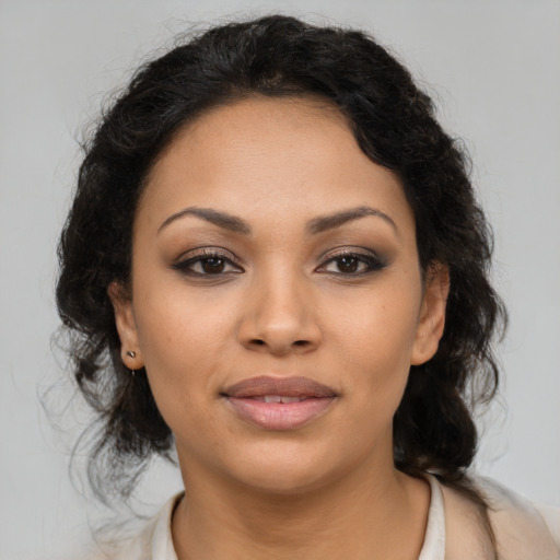 Joyful latino young-adult female with medium  brown hair and brown eyes