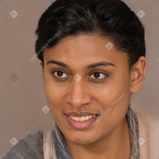 Joyful latino young-adult female with short  brown hair and brown eyes