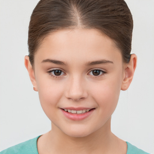 Joyful white child female with short  brown hair and brown eyes