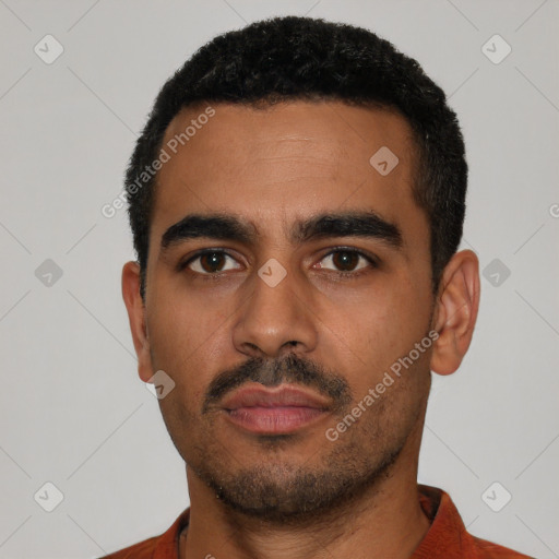 Neutral latino young-adult male with short  black hair and brown eyes