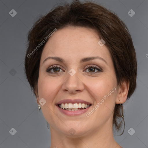 Joyful white adult female with medium  brown hair and brown eyes